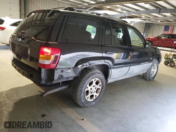 1999 Jeep Grand Cherokee Laredo с VIN 1J4G258S1XC695118, выставлен на аукционе Copart как лот 80684405 с пробегом 164 808 миль миль и Списание • Salvage title. История ставок и продаж доступна на DreamBid. Изображение 3.