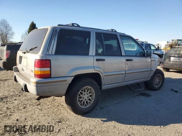 1995 Jeep Grand Cherokee Limited with VIN 1J4GZ78Y8SC709259, listed as a Copart auction lot 42639465 with 194,473 mi miles and Salvage title. Bid and sale history available at DreamBid. Image 3.