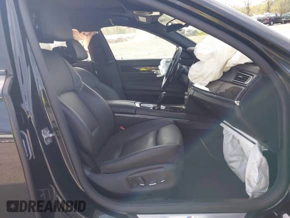 2015 BMW 7 Series with VIN WBAYG6C59FD383735, listed as a IAAI auction lot 42106255 with 107,936 mi miles and . Bid and sale history available at DreamBid. Image 5.