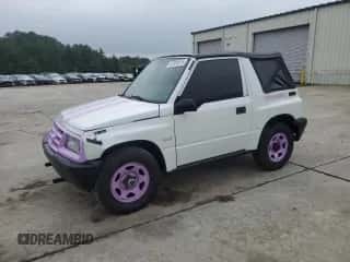 1998 Chevrolet Tracker with VIN 2CNBJ1866W6915810, listed as a Copart auction lot 67891015 with 158,033 mi miles and Salvage title. Bid and sale history available at DreamBid. Image 1.