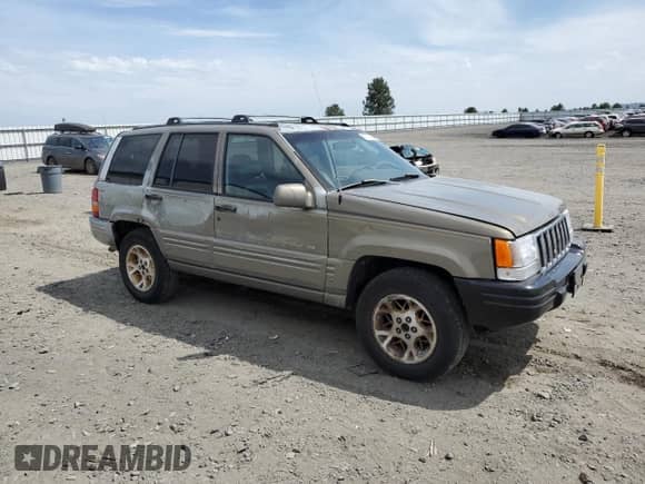 1996 Jeep Grand Cherokee Limited с VIN 1J4GZ78Y1TC342755, выставлен на аукционе Copart как лот 60710925 с пробегом 261 800 миль миль и Списание • Salvage title. История ставок и продаж доступна на DreamBid. Изображение 4.