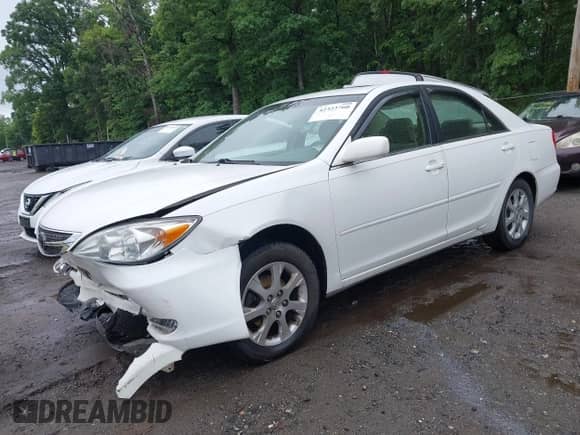2004 Toyota Camry LE with VIN JTDBE32K740273954, listed as a IAAI auction lot 42323760 with 250,815 mi miles and . Bid and sale history available at DreamBid. Image 2.