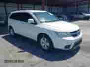 2012 Dodge Journey SXT z VIN 3C4PDCBB9CT394155, wystawiony jako IAAI lot #42570737 z przebiegiem 166 037 mil mil oraz . Historia ofert i sprzedaży dostępna na DreamBid. Obrazek 1.