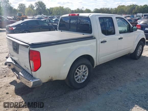 2016 Nissan Frontier SV z VIN 1N6AD0EV5GN795909, wystawiony jako IAAI lot #43356457 z przebiegiem 148 664 mil mil oraz . Historia ofert i sprzedaży dostępna na DreamBid. Obrazek 4.