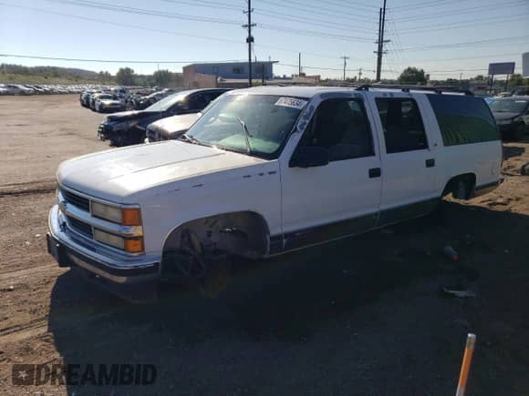 1995 Chevrolet Suburban with VIN 1GNFK16KXSJ398745, listed as a Copart auction lot 67475634 with 165,548 mi miles and Salvage title. Bid and sale history available at DreamBid. Image 1.