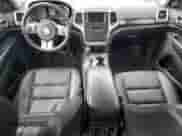 2012 Jeep Grand Cherokee Laredo with VIN 1C4RJFAG1CC293722, listed as a Copart auction lot 68848665 with 114,707 mi miles and Salvage title. Bid and sale history available at DreamBid. Image 8.