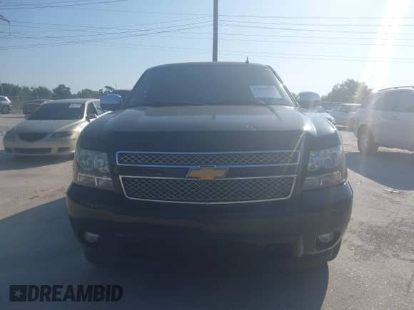2009 Chevrolet Tahoe LTZ with VIN 1GNFC33089R297033, listed as a IAAI auction lot 42850828 with 310,614 mi miles and . Bid and sale history available at DreamBid. Image 12.