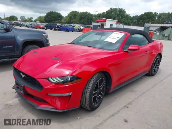 2022 Ford Mustang EcoBoost z VIN 1FATP8UH0N5104821, wystawiony jako IAAI lot #42669394 z przebiegiem 66 388 mil mil oraz . Historia ofert i sprzedaży dostępna na DreamBid. Obrazek 2.
