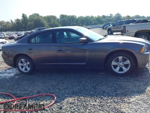 2014 Dodge Charger SE with VIN 2C3CDXBG7EH325384, listed as a IAAI auction lot 43031175 with 203,375 mi miles and . Bid and sale history available at DreamBid. Image 13.