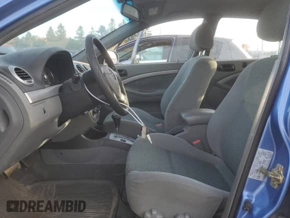 2005 Chevrolet Optra с VIN KL1JK69Z55K217355, выставлен на аукционе Copart как лот 76715574 с пробегом 111 798 миль миль и Чистый • Clean title. История ставок и продаж доступна на DreamBid. Изображение 7.