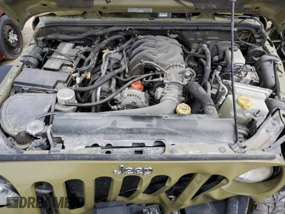 2013 Jeep Wrangler Rubicon with VIN 1C4HJWCG1DL574039, listed as a Copart auction lot 48728645 with 116,537 mi miles and Salvage title. Bid and sale history available at DreamBid. Image 14.