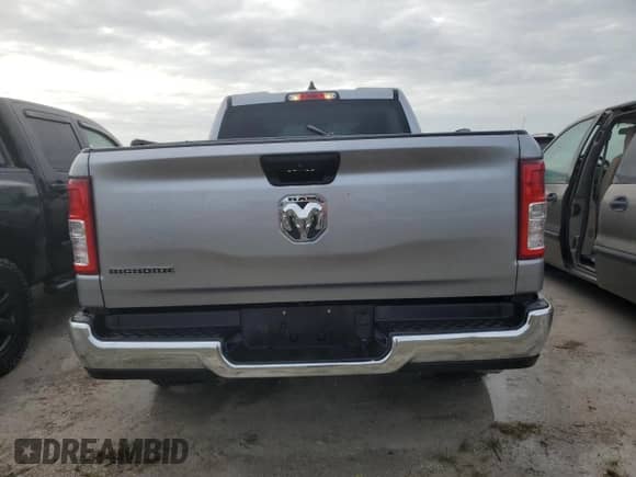 2023 Ram 1500 Big Horn z VIN 1C6RREBG3PN573970, wystawiony jako Copart lot #76163154 z przebiegiem 4 318 mil mil oraz Nie do naprawy • Non repairable. Historia ofert i sprzedaży dostępna na DreamBid. Obrazek 6.