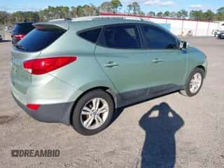 2013 Hyundai Tucson Limited z VIN KM8JU3AC0DU678244, wystawiony jako IAAI lot #43593885 z przebiegiem 142 787 mil mil oraz . Historia ofert i sprzedaży dostępna na DreamBid. Obrazek 4.