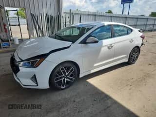2020 Hyundai Elantra Sport z VIN KMHD04LB3LU967961, wystawiony jako Copart lot #61435075 z przebiegiem 57 900 mil mil oraz Szkoda całkowita • Salvage title. Historia ofert i sprzedaży dostępna na DreamBid. Obrazek 1.