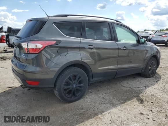 2017 Ford Escape SE с VIN 1FMCU9GD6HUA56720, выставлен на аукционе Copart как лот 70484625 с пробегом 128 058 миль миль и Чистый • Clean title. История ставок и продаж доступна на DreamBid. Изображение 3.