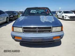 1993 Dodge Spirit z VIN 1B3XA46K0PF638477, wystawiony jako Copart lot #75710534 z przebiegiem 50 637 mil mil oraz Szkoda całkowita • Salvage title. Historia ofert i sprzedaży dostępna na DreamBid. Obrazek 5.