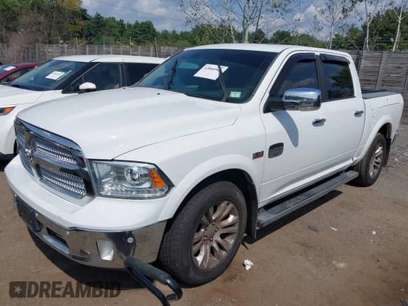 2015 Ram 1500 Laramie Longhorn with VIN 1C6RR7PT3FS728521, listed as a IAAI auction lot 42804961 with 119,644 mi miles and . Bid and sale history available at DreamBid. Image 2.
