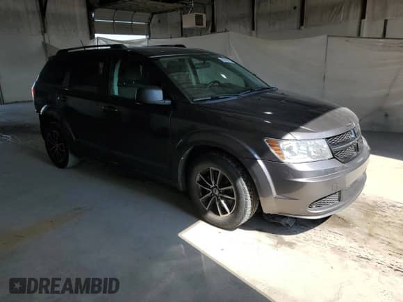 2018 Dodge Journey SE with VIN 3C4PDCAB8JT363798, listed as a Copart auction lot 69056075 with 112,138 mi miles and Salvage title. Bid and sale history available at DreamBid. Image 4.