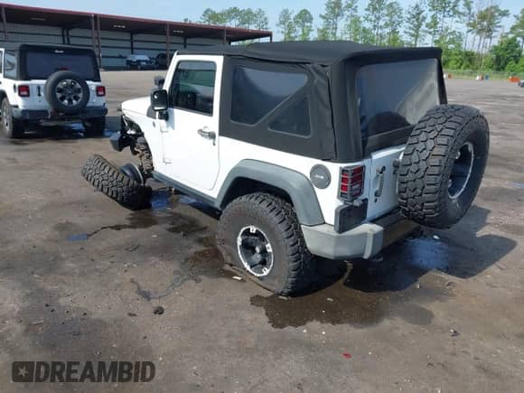 2015 Jeep Wrangler Sport with VIN 1C4AJWAG9FL747006, listed as a IAAI auction lot 42303813 with 110,194 mi miles and . Bid and sale history available at DreamBid. Image 3.