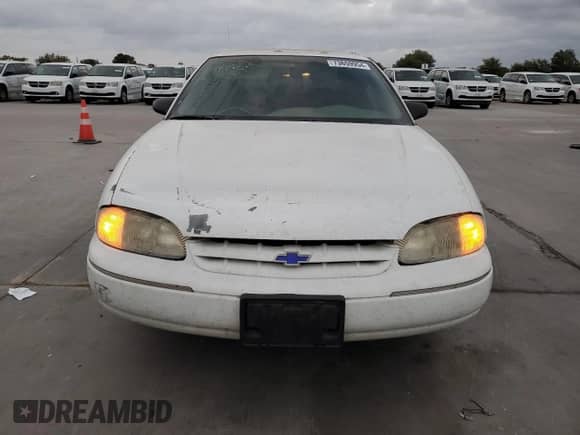 1997 Chevrolet Lumina LS with VIN 2G1WL52M5V9107095, listed as a Copart auction lot 73659954 with 135,669 mi miles and Salvage title. Bid and sale history available at DreamBid. Image 5.