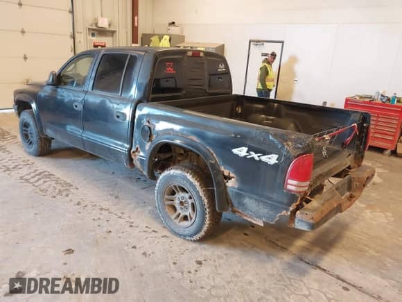 2003 Dodge Dakota Sport z VIN 1D7HG38N03S144856, wystawiony jako IAAI lot #41842049 z przebiegiem 162 788 mil mil oraz . Historia ofert i sprzedaży dostępna na DreamBid. Obrazek 3.