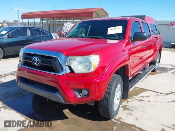 2014 Toyota Tacoma PreRunner with VIN 3TMKU4HN4EM041871, listed as a IAAI auction lot 41641763 with 148,968 mi miles and . Bid and sale history available at DreamBid. Image 2.