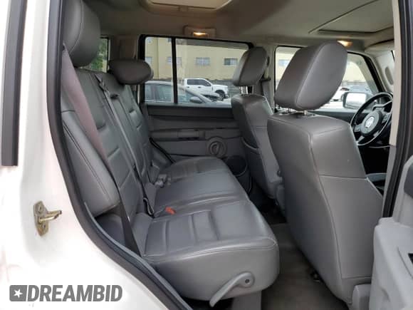 2006 Jeep Commander with VIN 1J8HH48N06C352871, listed as a Copart auction lot 87740115 with 163,703 mi miles and Salvage title. Bid and sale history available at DreamBid. Image 10.
