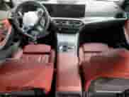 2023 BMW 3 Series 330i z VIN 3MW69FF0XP8C82901, wystawiony jako Copart lot #70327825 z przebiegiem 38 377 mil mil oraz Szkoda całkowita • Salvage title. Historia ofert i sprzedaży dostępna na DreamBid. Obrazek 8.