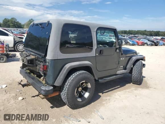 2005 Jeep Wrangler X z VIN 1J4FA39S65P325984, wystawiony jako Copart lot #84242945 z przebiegiem 103 045 mil mil oraz Szkoda całkowita • Salvage title. Historia ofert i sprzedaży dostępna na DreamBid. Obrazek 3.