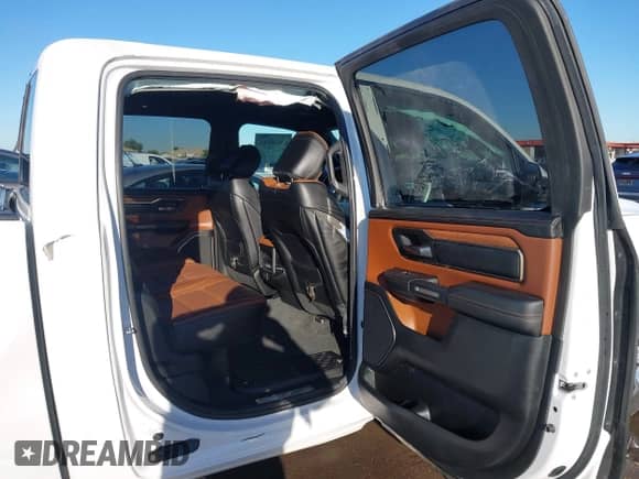 2021 Ram 1500 Longhorn with VIN 1C6SRFKT7MN679290, listed as a IAAI auction lot 43450315 with 55,494 mi miles and . Bid and sale history available at DreamBid. Image 8.