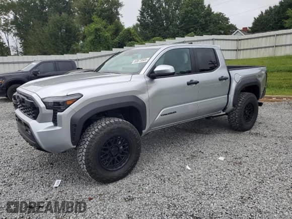 2024 Toyota Tacoma SR5 with VIN 3TYLB5JN8RT060119, listed as a Copart auction lot 83873505 with 25 mi miles and Salvage title. Bid and sale history available at DreamBid. Image 1.