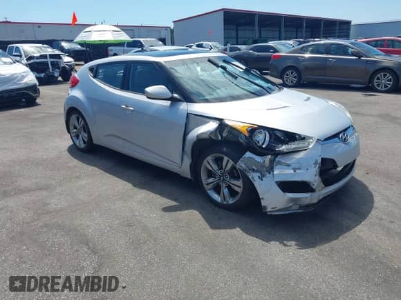 2012 Hyundai Veloster w/Gray Int z VIN KMHTC6AD0CU049684, wystawiony jako IAAI lot #43132772 z przebiegiem 114 146 mil mil oraz . Historia ofert i sprzedaży dostępna na DreamBid. Obrazek 1.