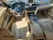 2014 BMW 3 Series 328i xDrive with VIN WBA3B3C51EJ981034, listed as a Copart auction lot 71869695 with 160,025 mi miles and Salvage title. Bid and sale history available at DreamBid. Image 8.