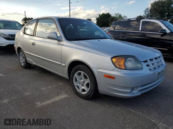 2004 Hyundai Accent GL с VIN KMHCG35C74U312579, выставлен на аукционе Copart как лот 75397884 с пробегом Не указан миль и Списание • Salvage title. История ставок и продаж доступна на DreamBid. Изображение 4.