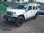 2024 Jeep Wrangler Sahara with VIN 1C4RJXP61RW193907, listed as a IAAI auction lot 42591776 with 11,874 mi miles and . Bid and sale history available at DreamBid. Image 2.