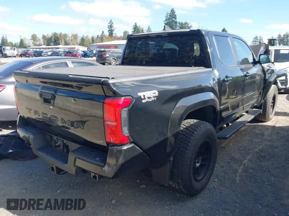 2024 Toyota Tacoma SR5 with VIN 3TMLB5JN4RM080833, listed as a IAAI auction lot 43404104 with 19,266 mi miles and . Bid and sale history available at DreamBid. Image 4.