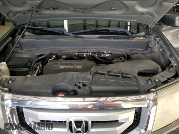 2009 Honda Pilot LX with VIN 5FNYF38219B009703, listed as a Copart auction lot 86054625 with 215,143 mi miles and Clean title. Bid and sale history available at DreamBid. Image 12.