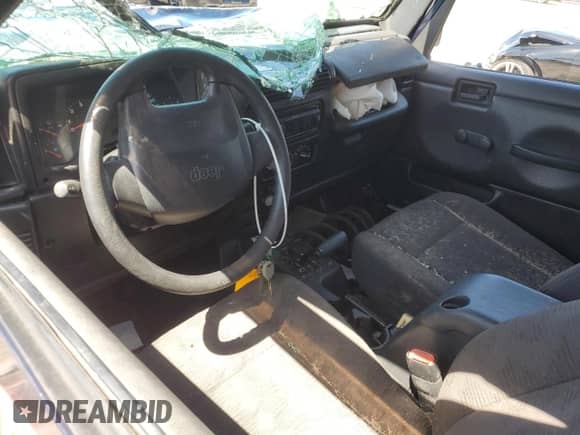 2003 Jeep Wrangler X z VIN 1J4FA39S43P357281, wystawiony jako Copart lot #67979335 z przebiegiem Nie podano mil oraz Szkoda całkowita • Salvage title. Historia ofert i sprzedaży dostępna na DreamBid. Obrazek 8.