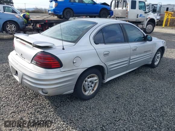 2001 Pontiac Grand Am SE1 with VIN 1G2NF52TX1M560650, listed as a IAAI auction lot 41654339 with 122,885 mi miles and . Bid and sale history available at DreamBid. Image 4.