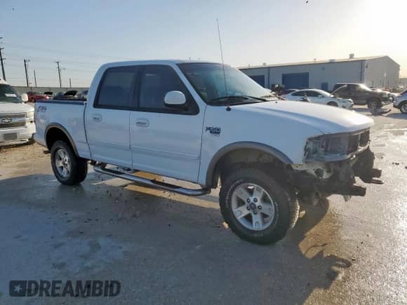 2002 Ford F-150 XLT с VIN 1FTRW08692KD89789, выставлен на аукционе Copart как лот 52621555 с пробегом 150 012 миль миль и Списание • Salvage title. История ставок и продаж доступна на DreamBid. Изображение 4.