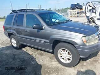 2003 Jeep Grand Cherokee Laredo z VIN 1J4GX48S63C578270, wystawiony jako IAAI lot #42656724 z przebiegiem 216 000 mil mil oraz . Historia ofert i sprzedaży dostępna na DreamBid. Obrazek 1.