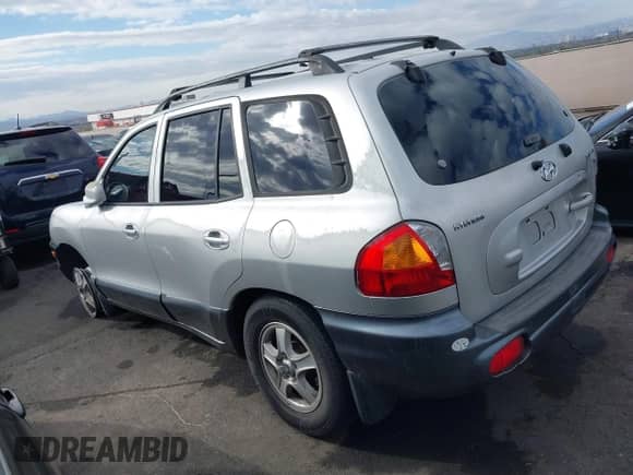2002 Hyundai Santa Fe GLS with VIN KM8SC13D62U322962, listed as a IAAI auction lot 41437333 with 183,711 mi miles and . Bid and sale history available at DreamBid. Image 3.