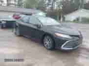 2023 Toyota Camry Hybrid XLE with VIN 4T1F31AK7PU602464, listed as a IAAI auction lot 43392293 with 41,716 mi miles and . Bid and sale history available at DreamBid. Image 1.