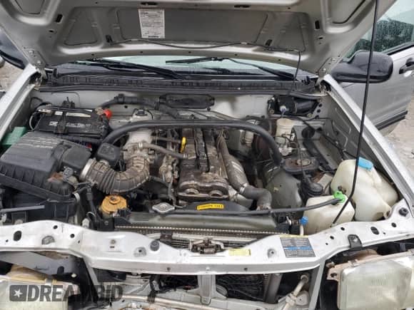 2003 Chevrolet Tracker с VIN 2CNBJ13C636952168, выставлен на аукционе Copart как лот 43199755 с пробегом Не указан миль и Списание • Salvage title. История ставок и продаж доступна на DreamBid. Изображение 12.
