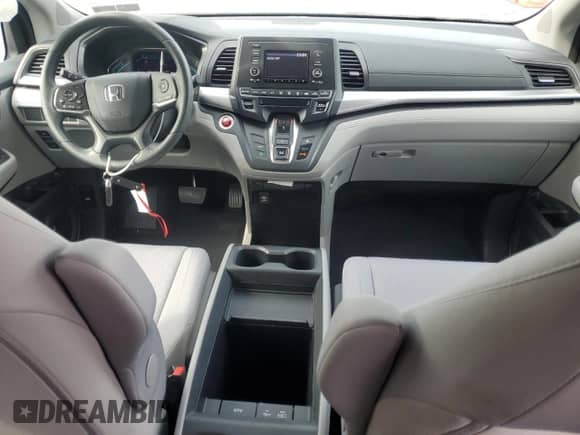 2018 Honda Odyssey LX with VIN 5FNRL6H29JB043696, listed as a Copart auction lot 80569835 with 29,515 mi miles and Salvage title. Bid and sale history available at DreamBid. Image 8.