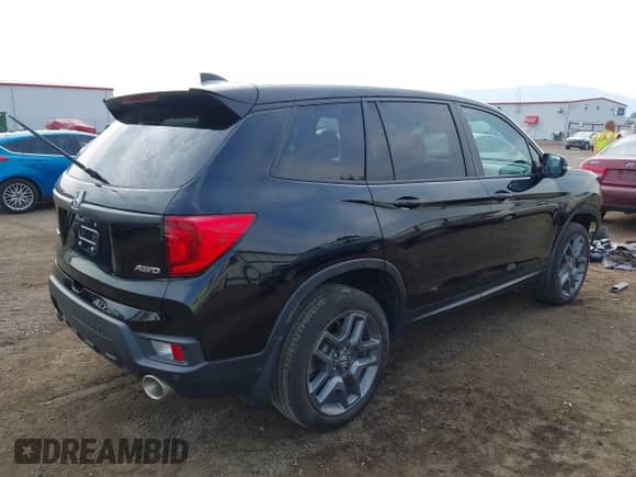 2022 Honda Passport EX-L with VIN 5FNYF8H59NB024628, listed as a IAAI auction lot 43084397 with 33,671 mi miles and . Bid and sale history available at DreamBid. Image 4.