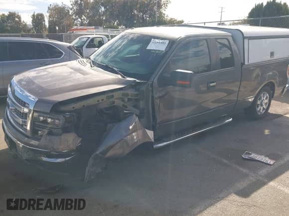 2013 Ford F-150 XL with VIN 1FTFX1CF2DKE23717, listed as a IAAI auction lot 43295385 with 202,229 mi miles and . Bid and sale history available at DreamBid. Image 2.