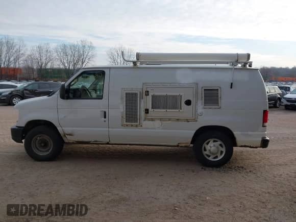 2013 Ford Econoline Cargo Commercial with VIN 1FTNE2EL6DDB01466, listed as a IAAI auction lot 41172240 with 173,124 mi miles and . Bid and sale history available at DreamBid. Image 14.