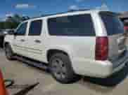 2008 Chevrolet Suburban LTZ with VIN 1GNFC16018R182031, listed as a Copart auction lot 65017175 with 157,581 mi miles and Salvage title. Bid and sale history available at DreamBid. Image 2.