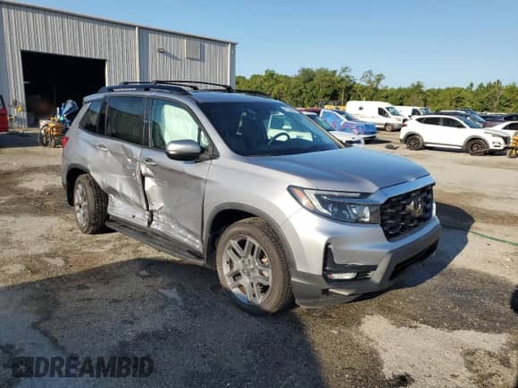 2023 Honda Passport EX-L with VIN 5FNYF8H55PB008414, listed as a Copart auction lot 67765585 with 18,682 mi miles and Non repairable. Bid and sale history available at DreamBid. Image 4.